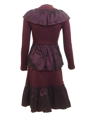 Back view of burgundy tiered taffeta dress.